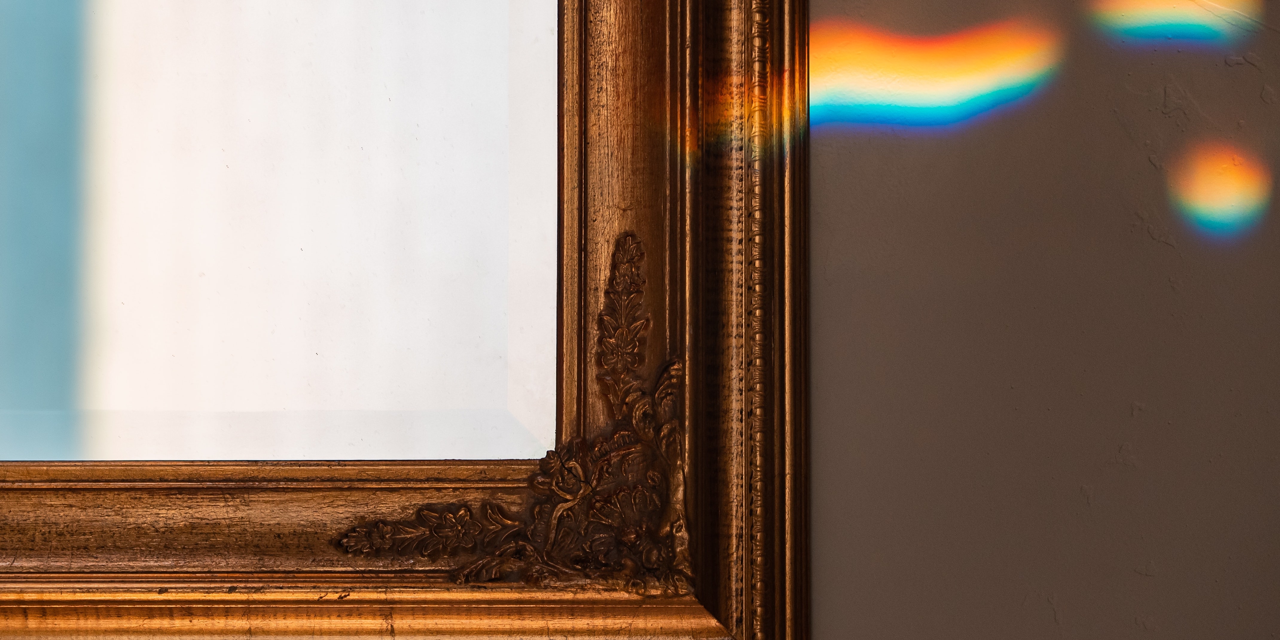 Light reflecting in a mirror creating a rainbow effect