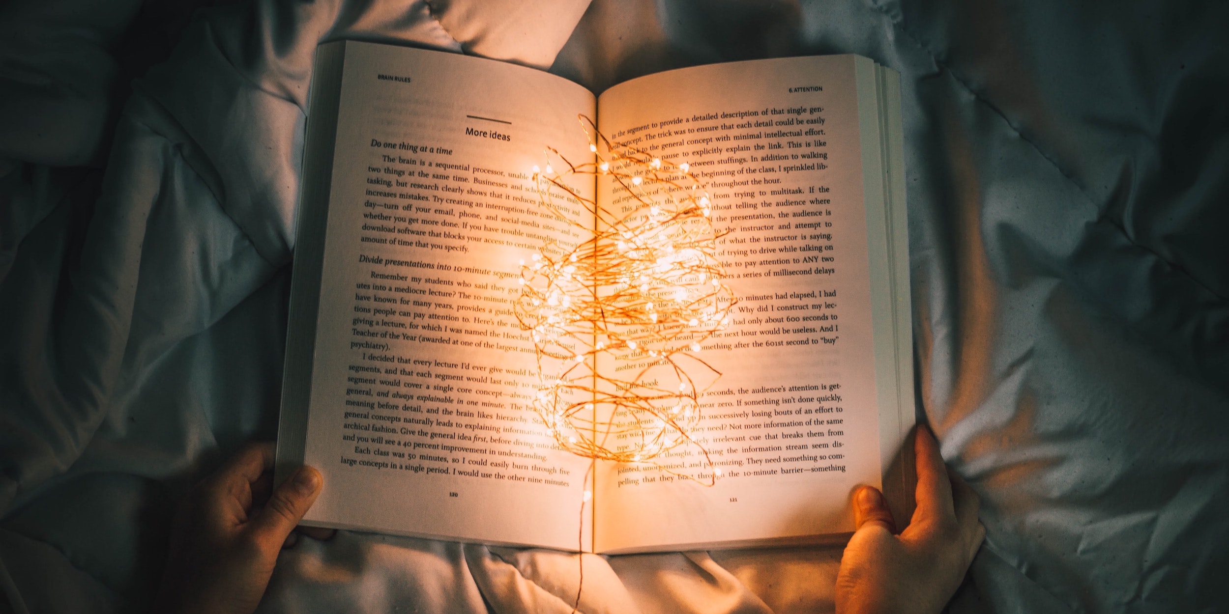 An open book with fairy lights